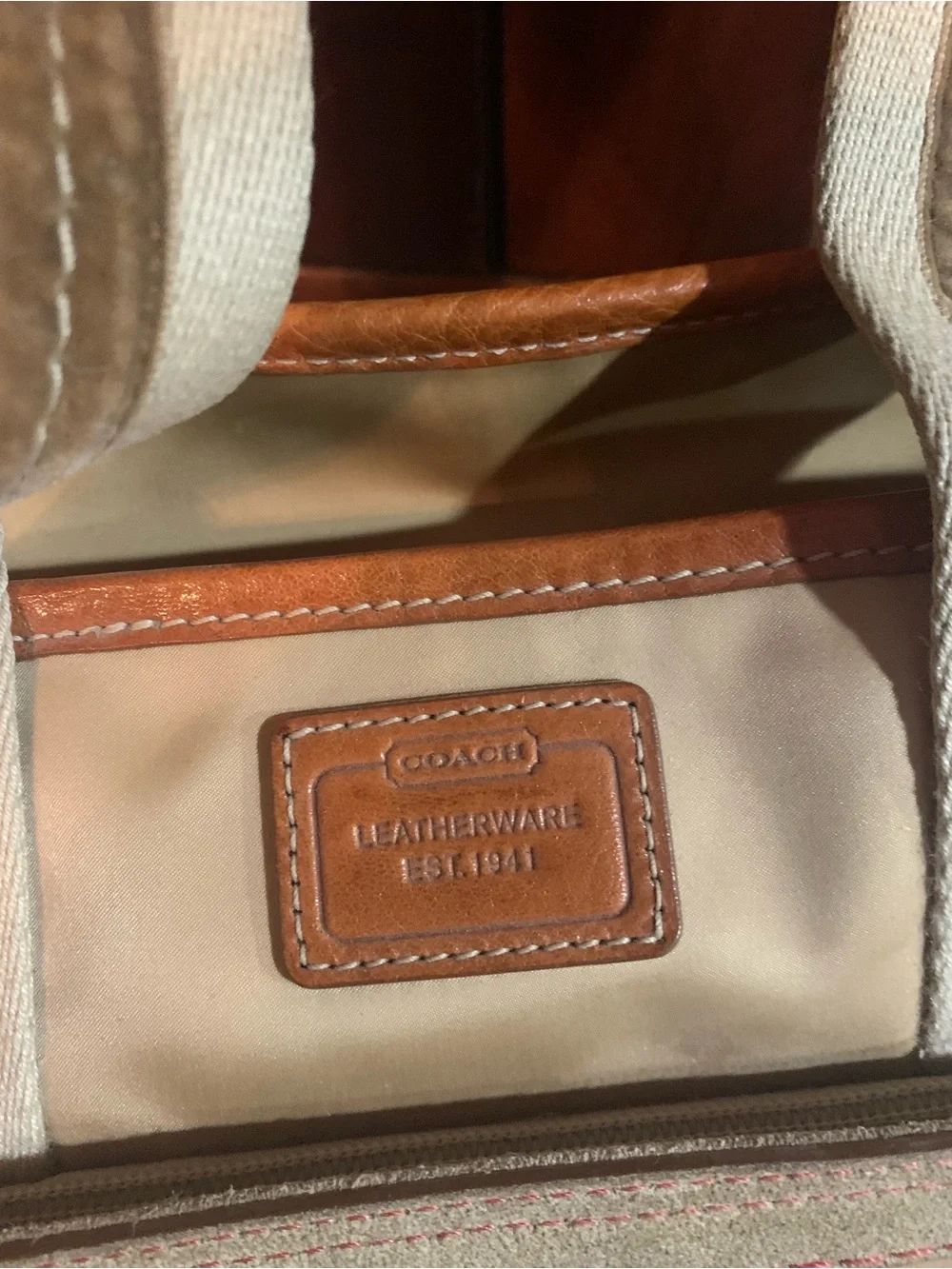 Coach Beige Tote with Tan Leather Trim and Pink/Burgundy Pom Charms